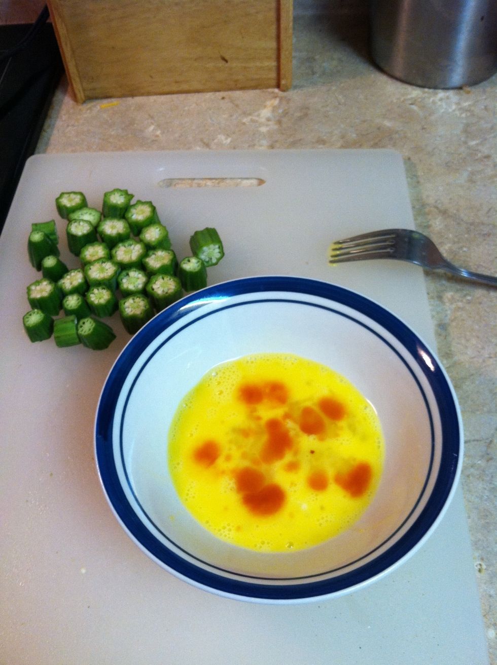 Wisk egg & hot sauce (optional) until well blended.