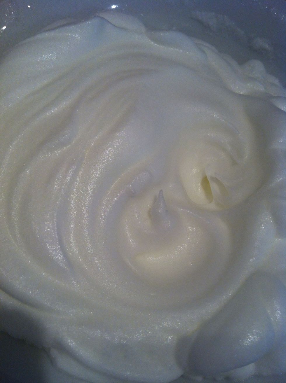 Wisk, wisk, wisk and wisk the egg whites untill they look like the above picture. No liquid should remain just a fluffy white mixture.
