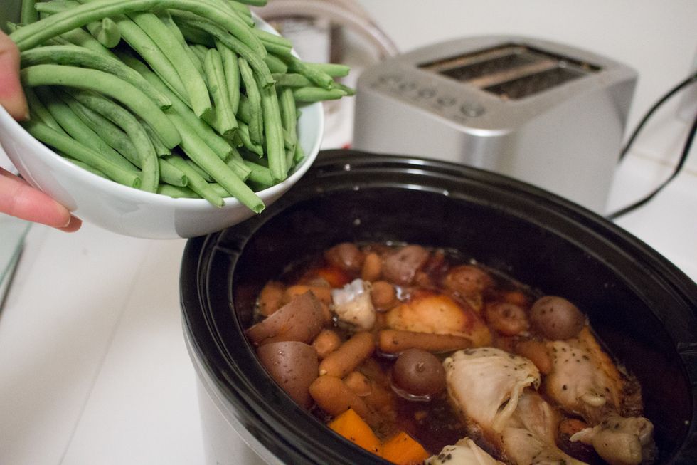 With 30 minutes to go, open the slow cooker lid and add your green beans.