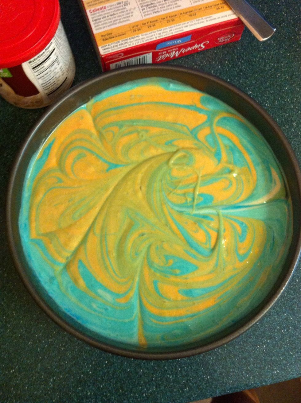 With a butter knife, swirl it into a design. Move the butter knife back and fourth, up and down until you are satisfied with the design.