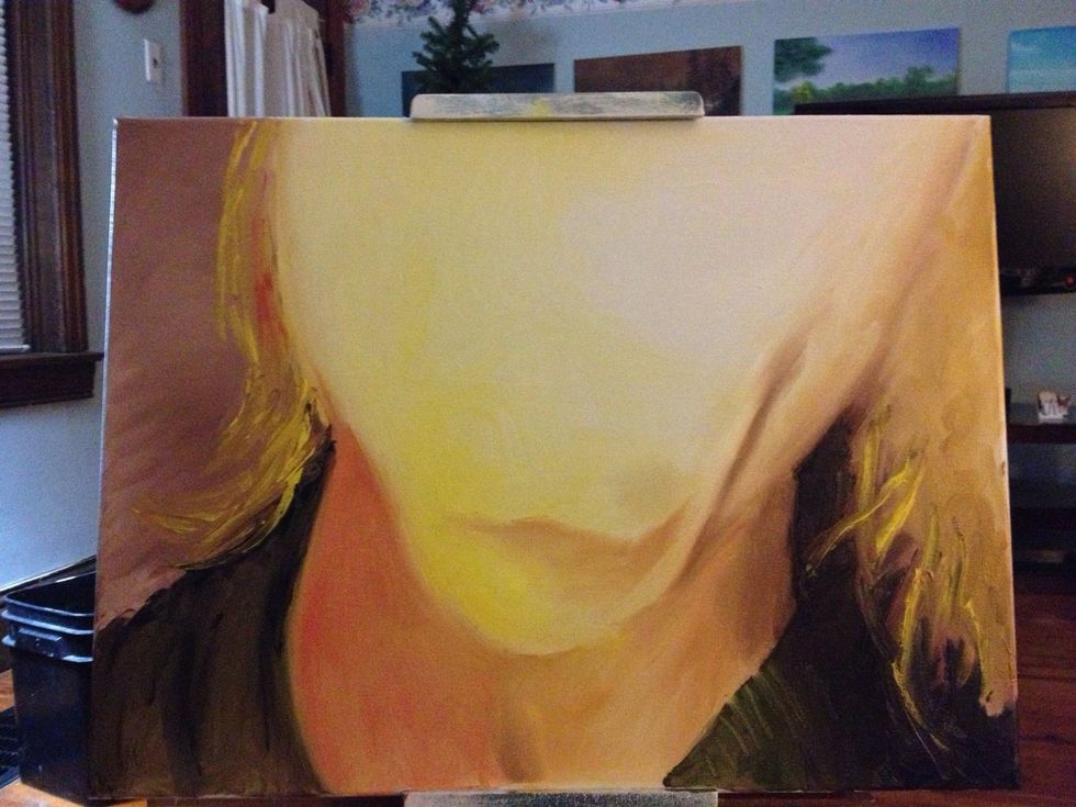 With a clean hand, I scrape a few ribs on the neck of the sweater. I start to add some shadow to the face. Clean the hand once more and add hair with yellows and reds.