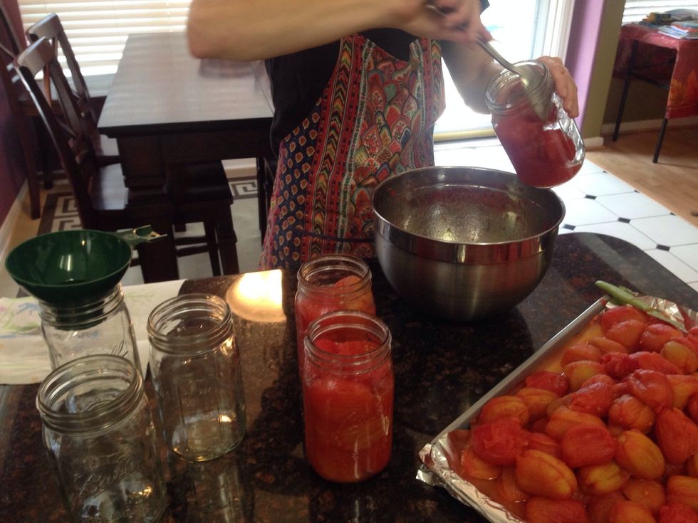 With a clean stainless steal spoon, fill each jar to the top leaving 1" room.