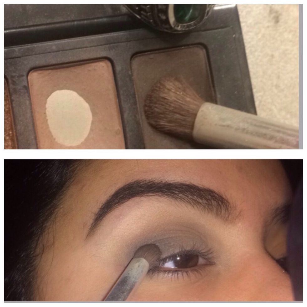 With a dense brush, get a dark charcoal grey and put it on the outer \u201cv\u201d of your eye. Slowly work it close into the center of your lid.