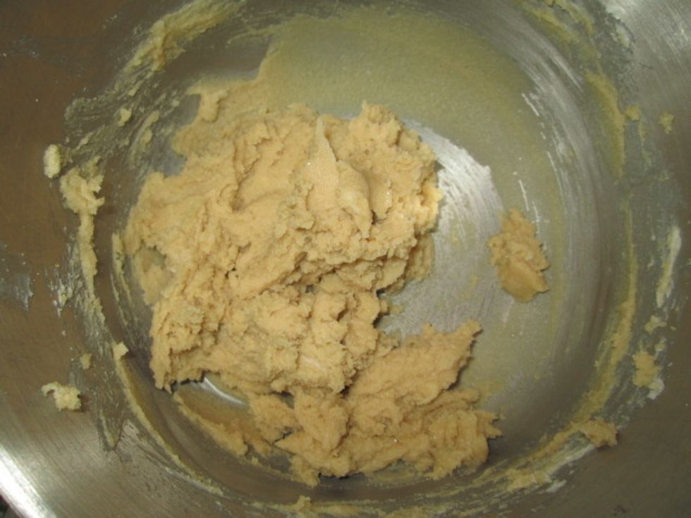 With a electric mixer, cream together both sugars and the butter.