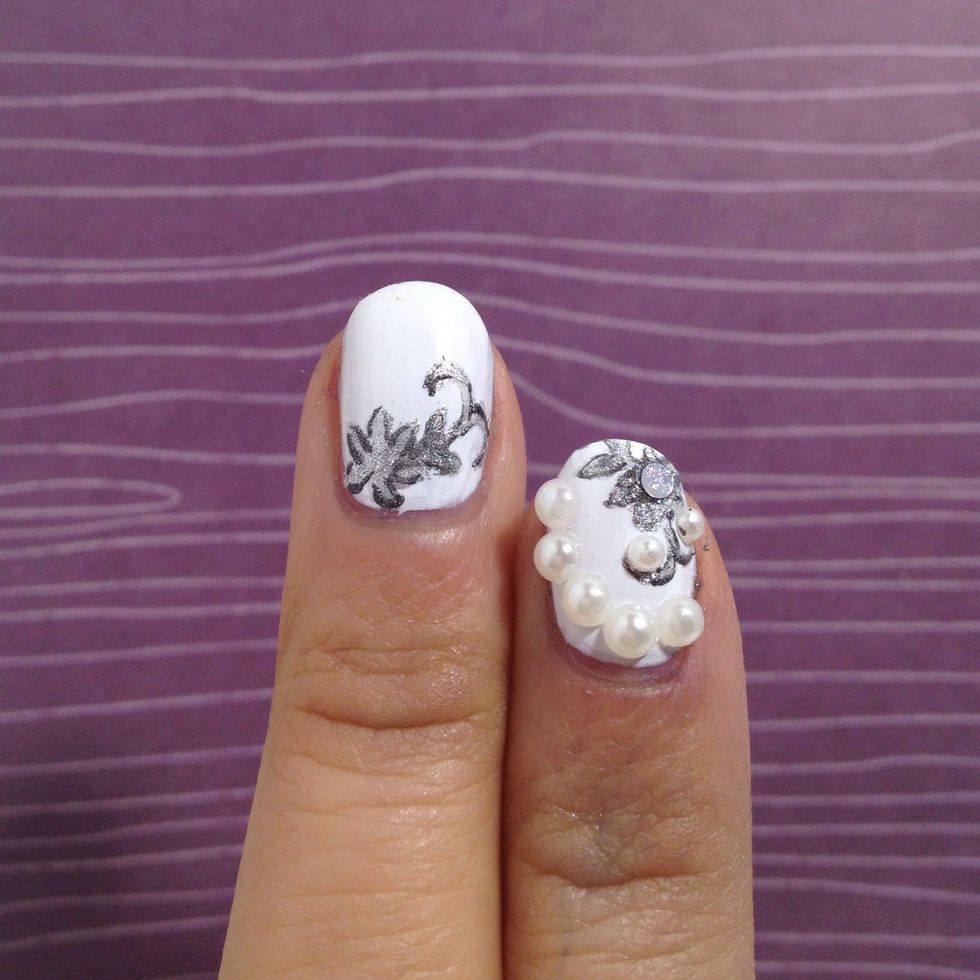 With a fine nail art brush, create outline of the pendant to give it some "shadow". You do not have to encircle the whole pendant.