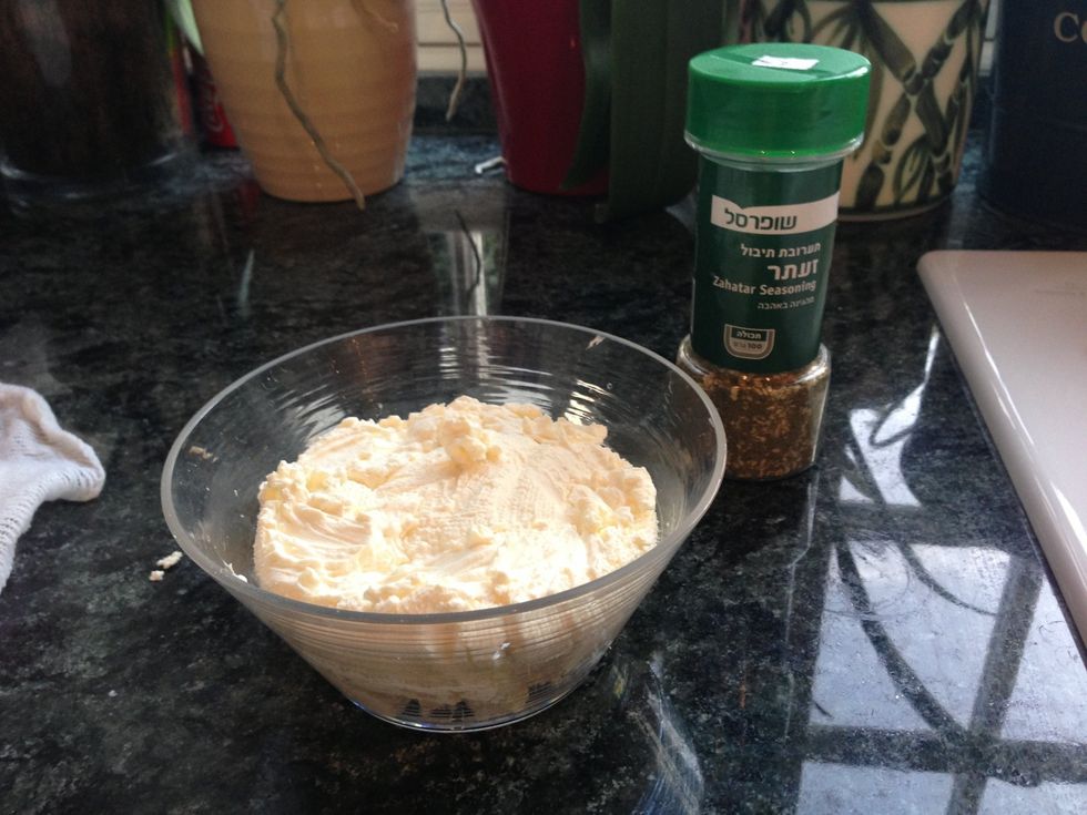 With a fork flatten down slightly the Labeneh and then sprinkle on Za'tar.