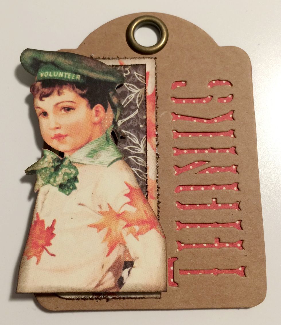 With a fourth red dot thanks tag, foam square the boy overtop of the brown floral piece.