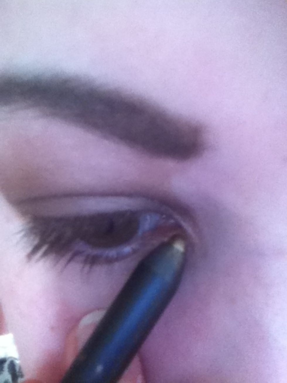 With a gold/bronze eyeliner, line the bottom of your eye starting in the inner corner of your eye.