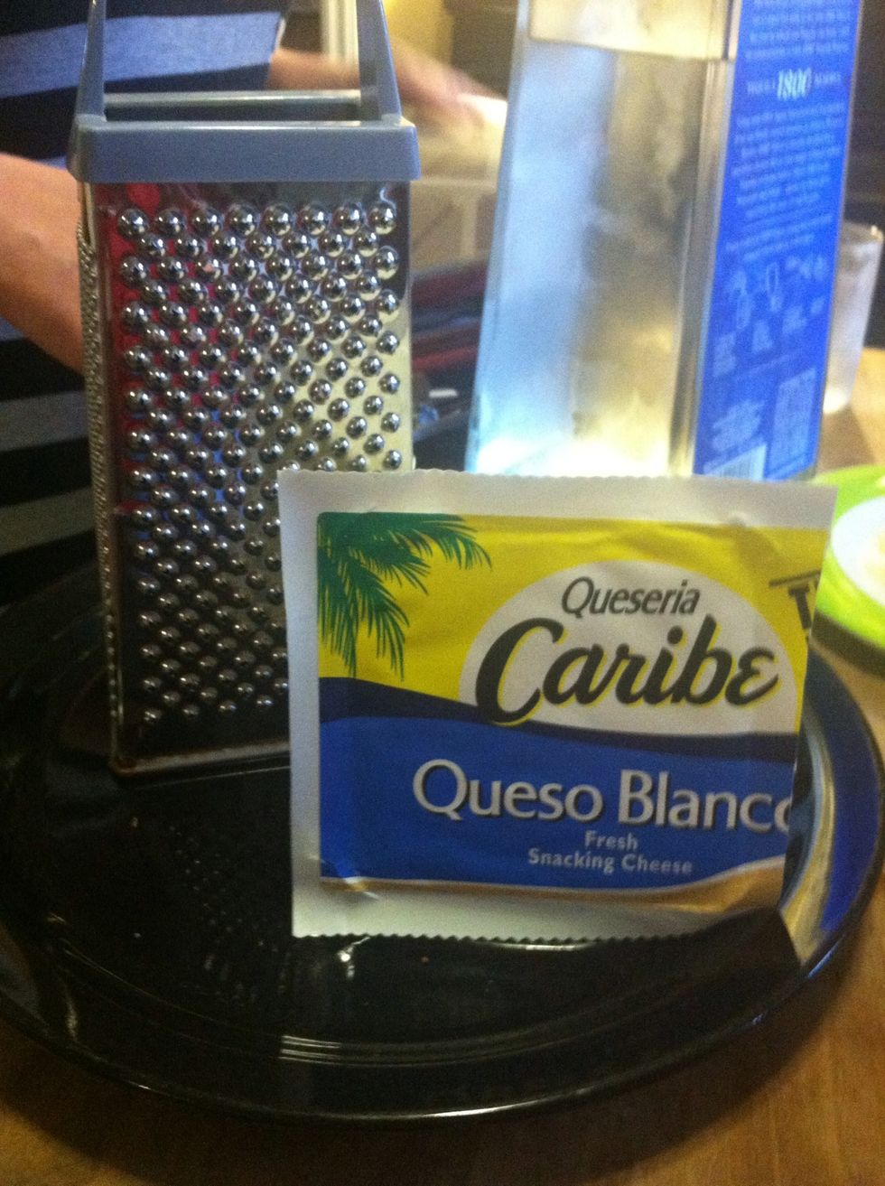With a grater shred the queso cheese.