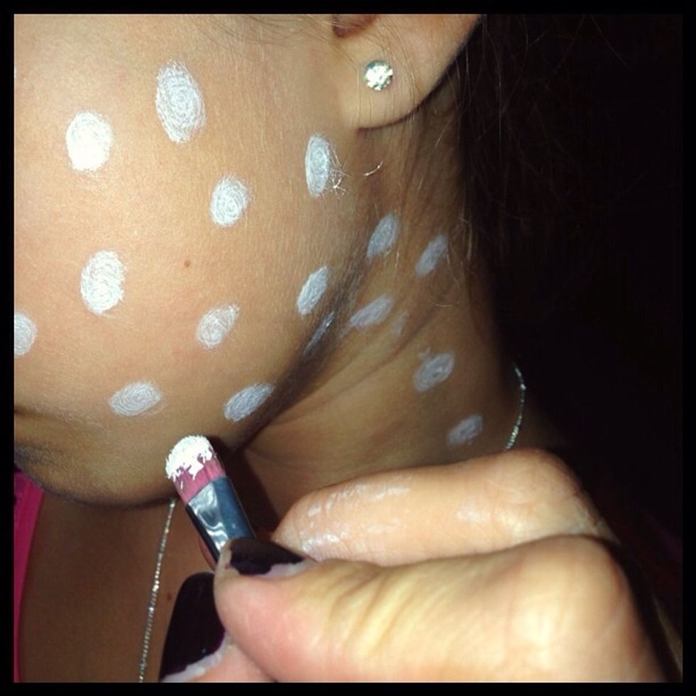 With a makeup brush sporadically place dots onto face