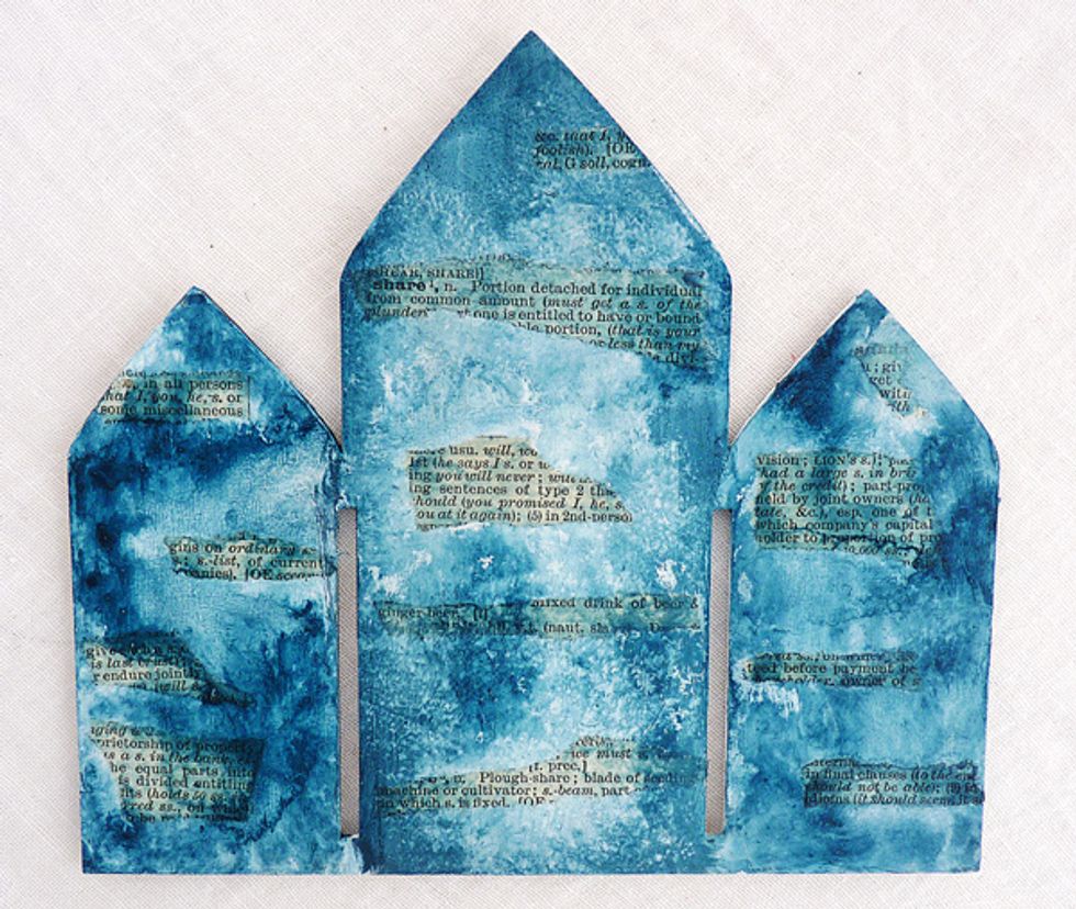 With a paintbrush, water spritzer and a piece of kitchen roll blend a darker tone of the colours you used on the frame and dry. I used Prussian Blue.