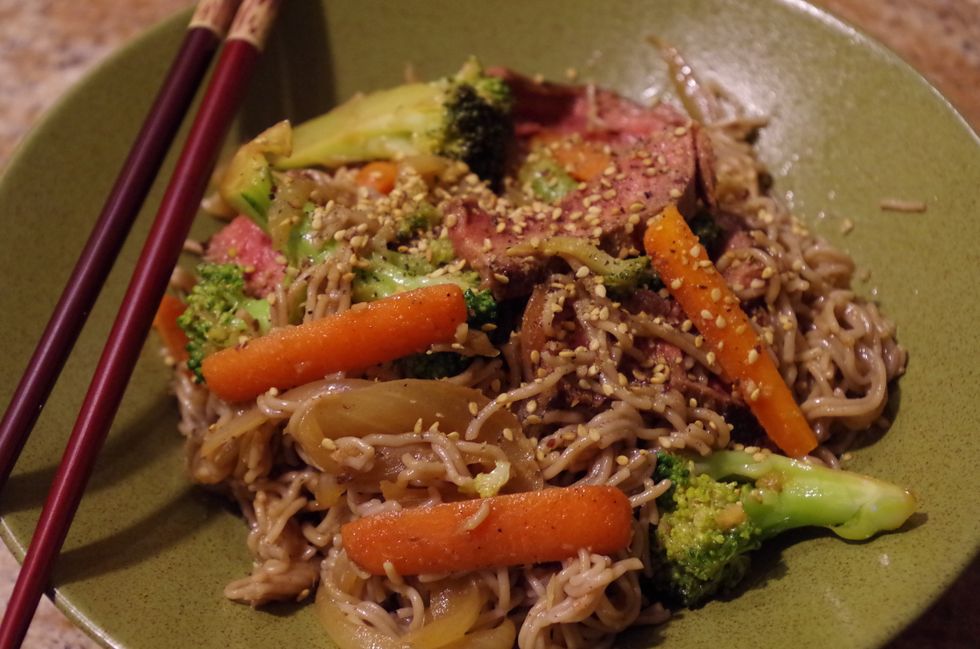 With a pair of tongs dish out stir fry into 2-3 bowls (depending how hungry you are!) then sprinkle with gomasio or sesame seeds. Enjoy!