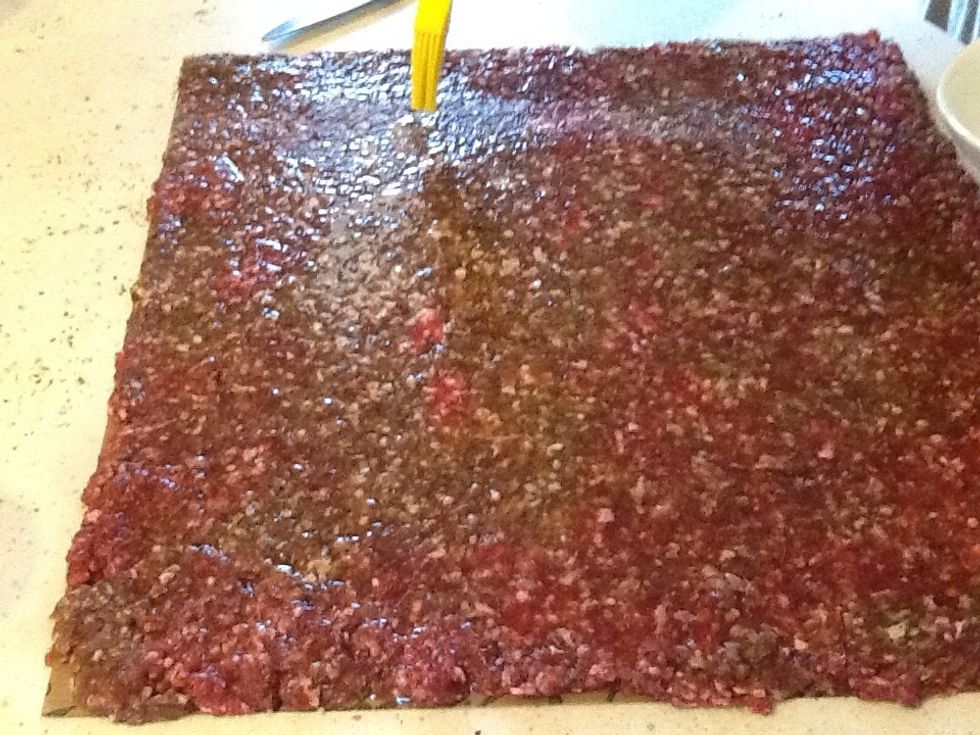 With a pastry brush, brush the aminos on the beef.