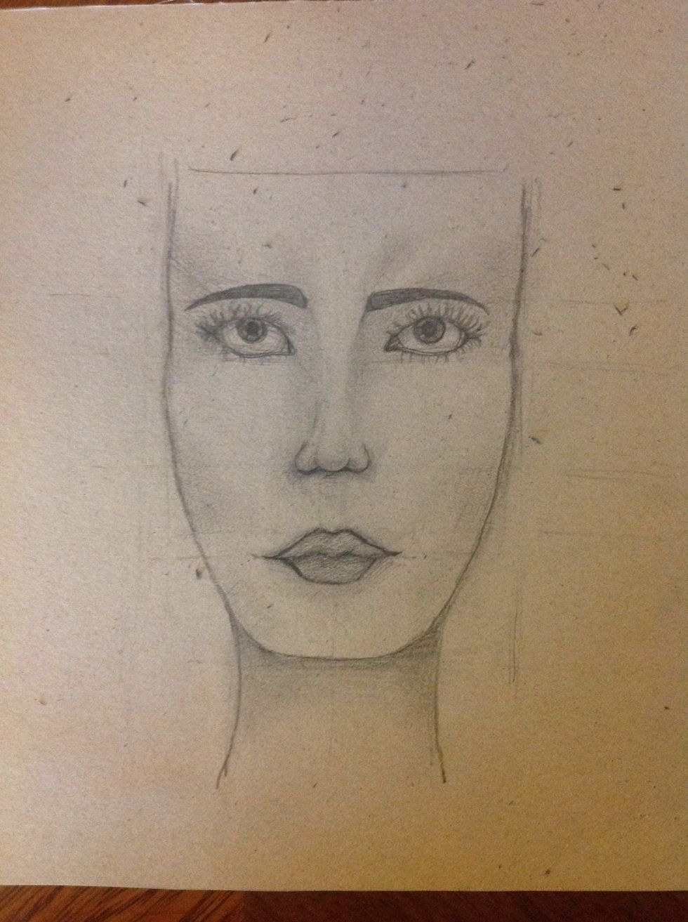 With a rubber erase all the shadows that  are no necessary and stress the lines of the face. Don't forget the neck!