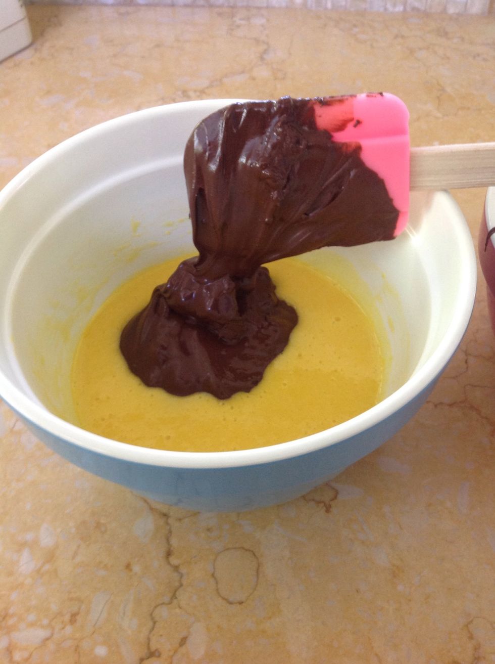 With a rubber spatula, fold in the melted chocolate.
