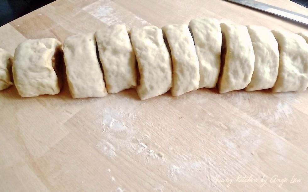 With a sharp knife, cut the dough crosswise into 12 equal pieces.