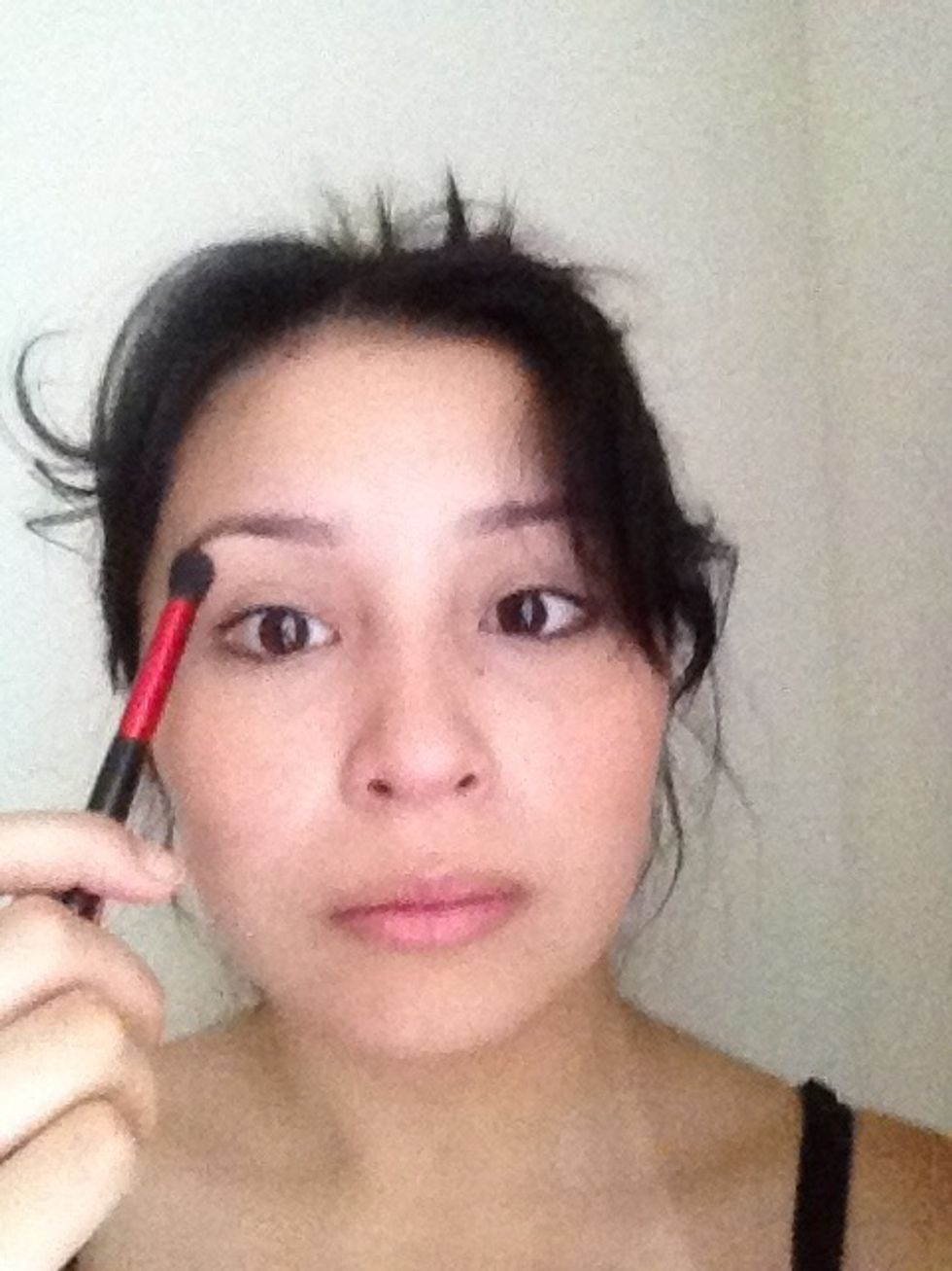 With a Small fluffy brush I have applied the highlighter to my cheek bones, my brow bone, and down the bridge of my nose. This will make them stand out