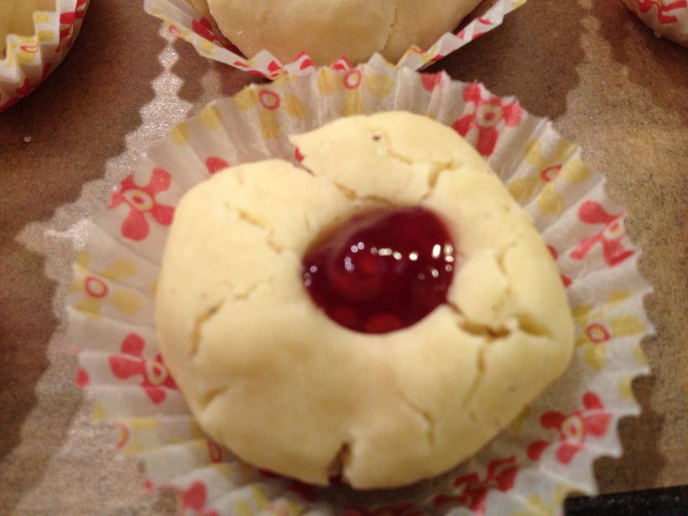 With a small teaspoon put a little dollop of jam in each hollow. I used raspberry jam, use what jam you like as long as it is quite firm.