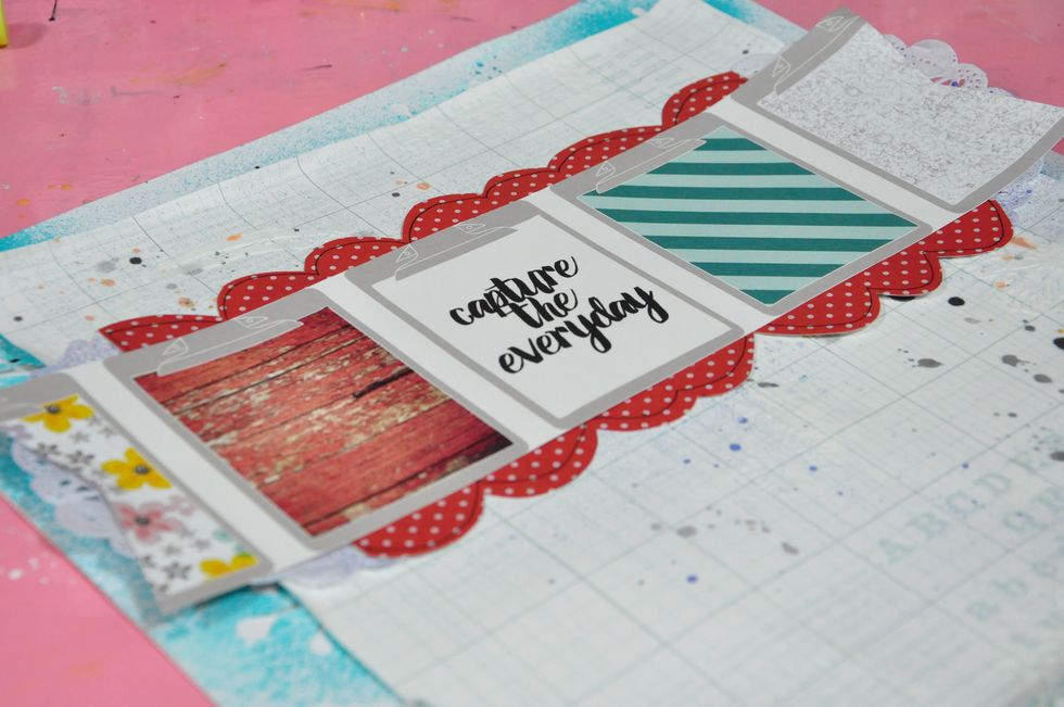 With a stencil, apply modeling paste and let it dry. For the scalloped red and white polka dot paper, I manually cut it and draw around the edges using a black pen.