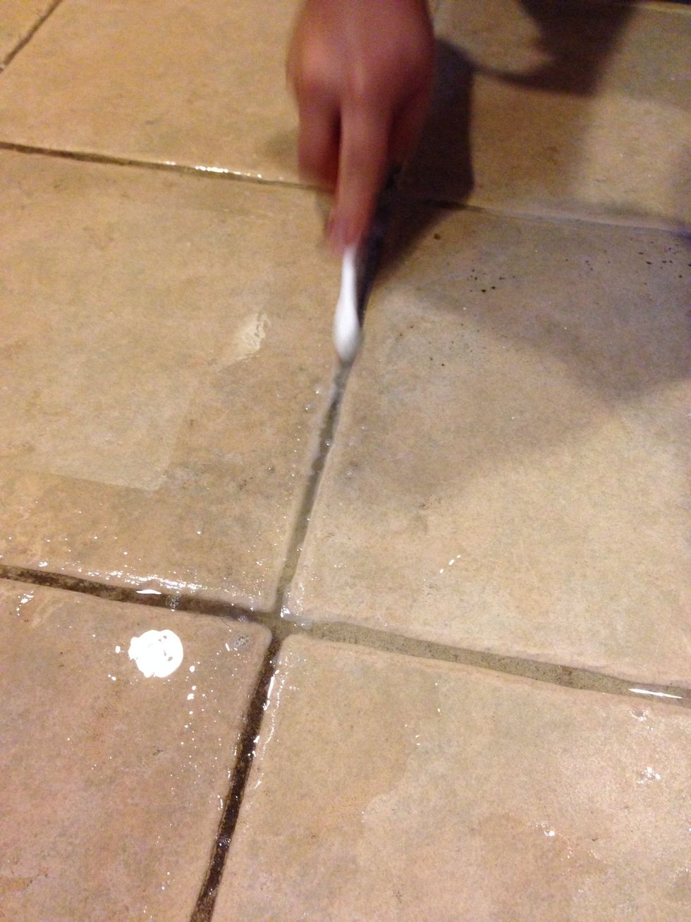 With a tooth brush scrub the grout lines. Peroxide action makes the dirt come out faster.