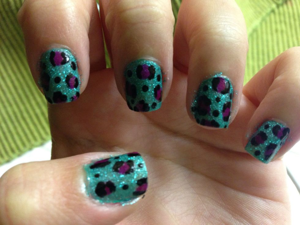 With a toothpick or dotting tool make lines around the spots and place dots around the empty space in your nail