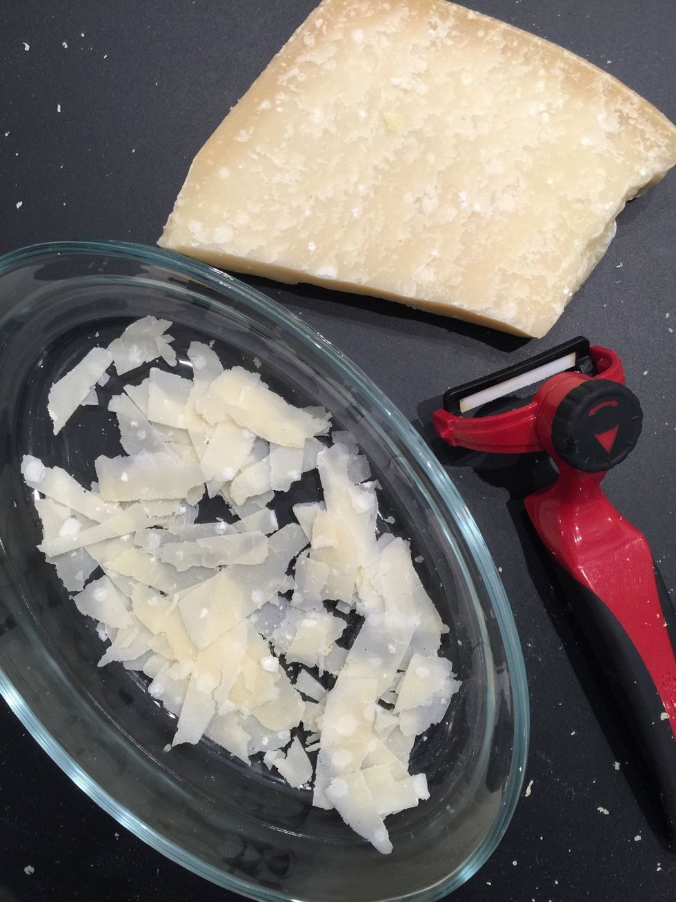 With a vegetable peeler, make flakes of Parmesan. Or, maybe you have ready grated Parmesan.!