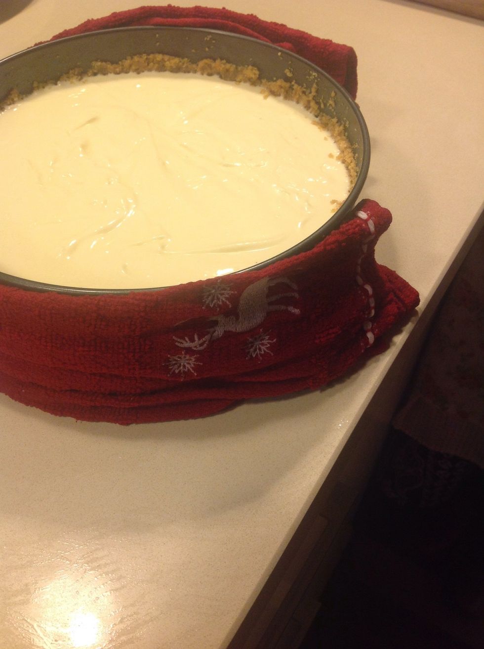 With a warm, folded tea towel press against the sides