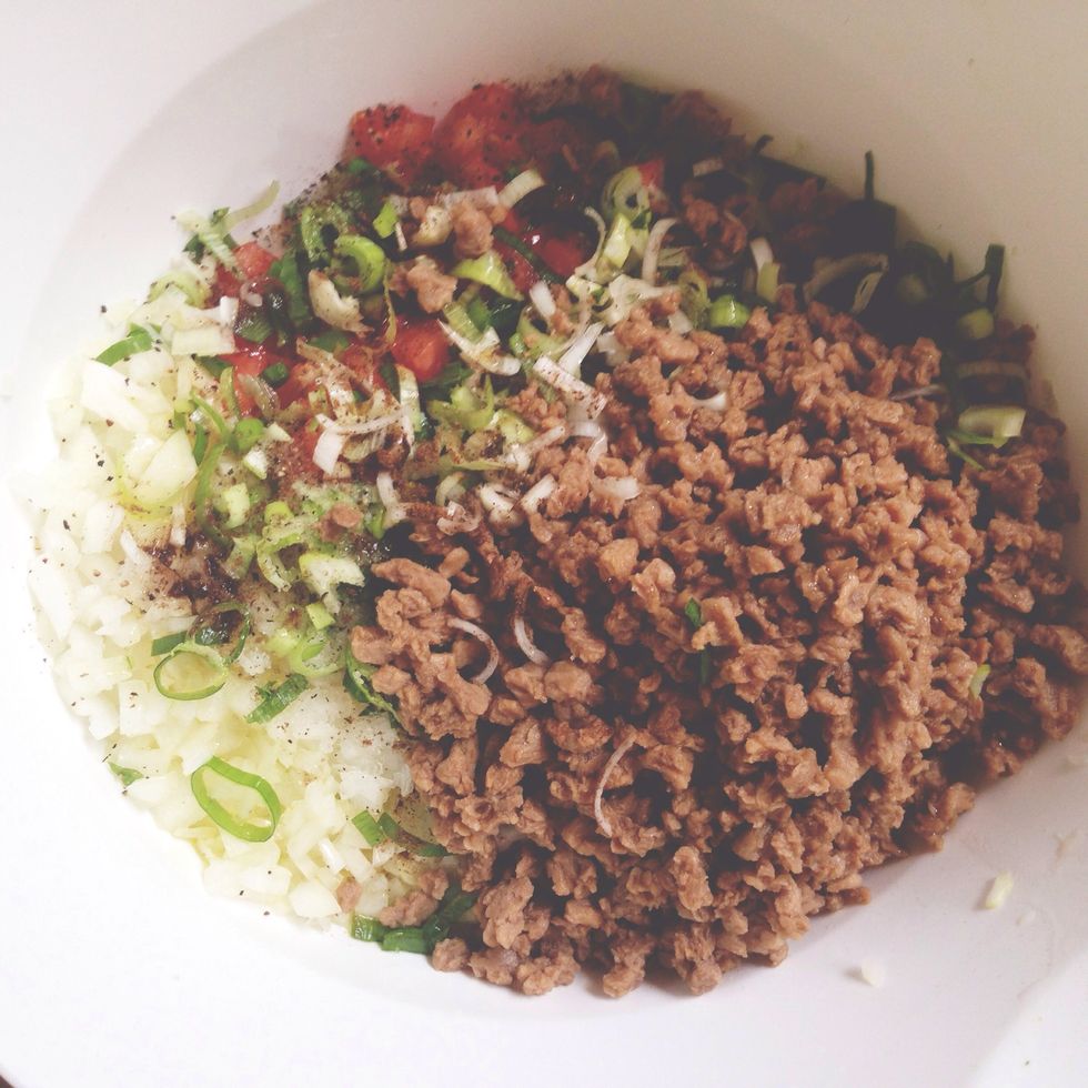 With all of the filling ingredients in the bowl, season with salt (approximately 1 tbsp) and a dash of freshly cracked black pepper. It will look something like this before it is all mixed.