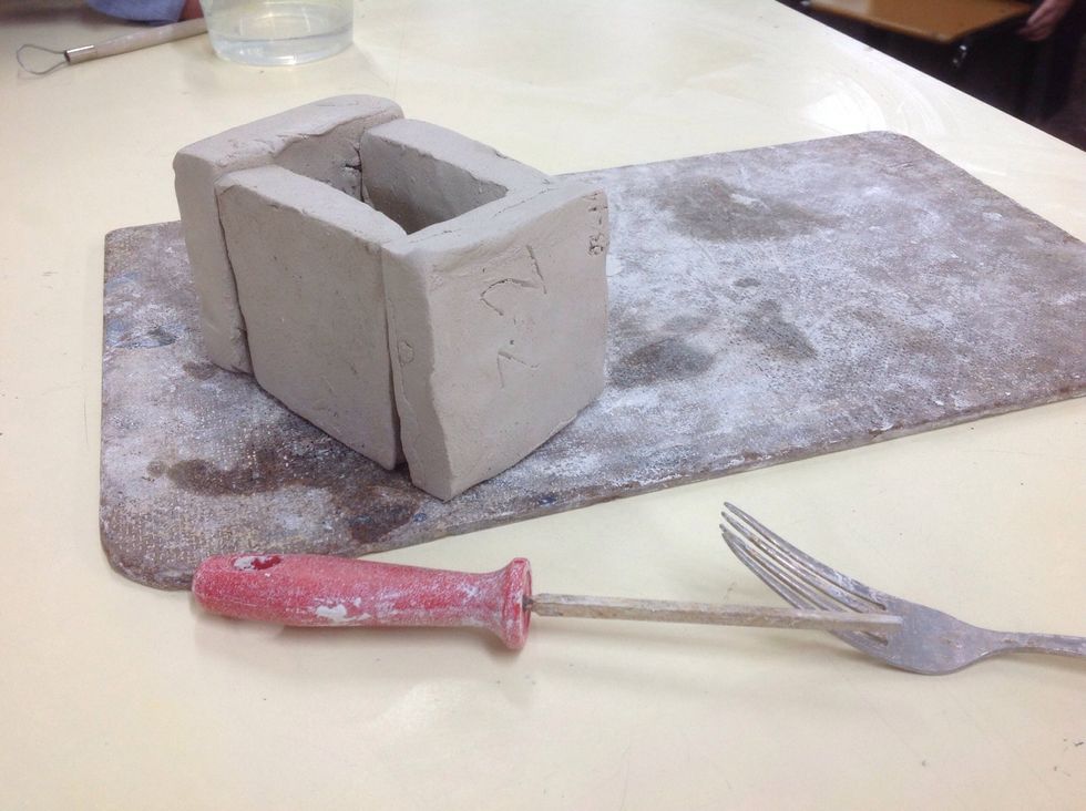 With all your squares you need to position them so then there in a cube with no top or bottom on it