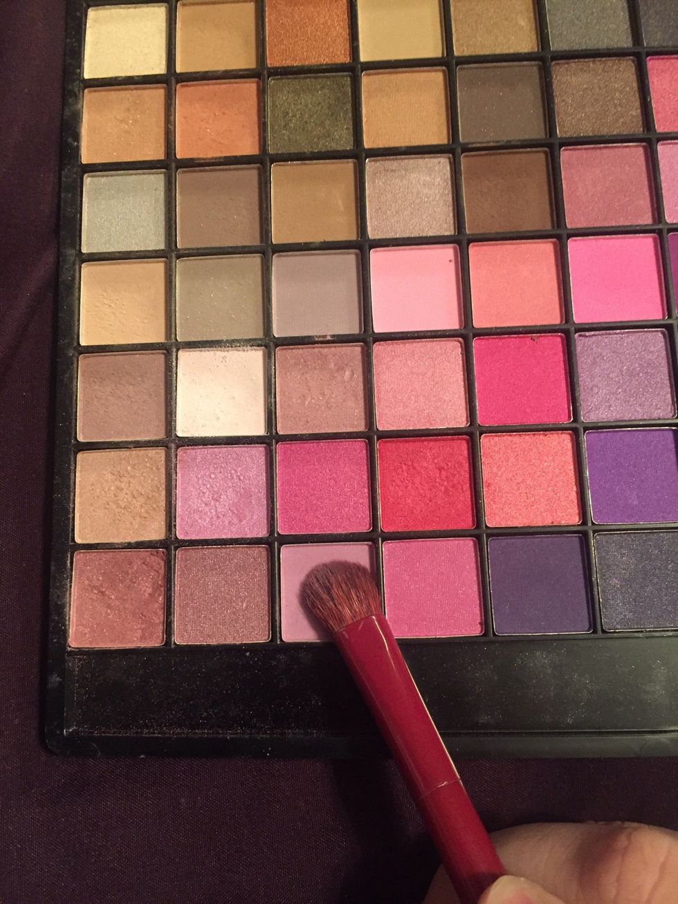 With another clean brush apply it with this eyeshadow.
