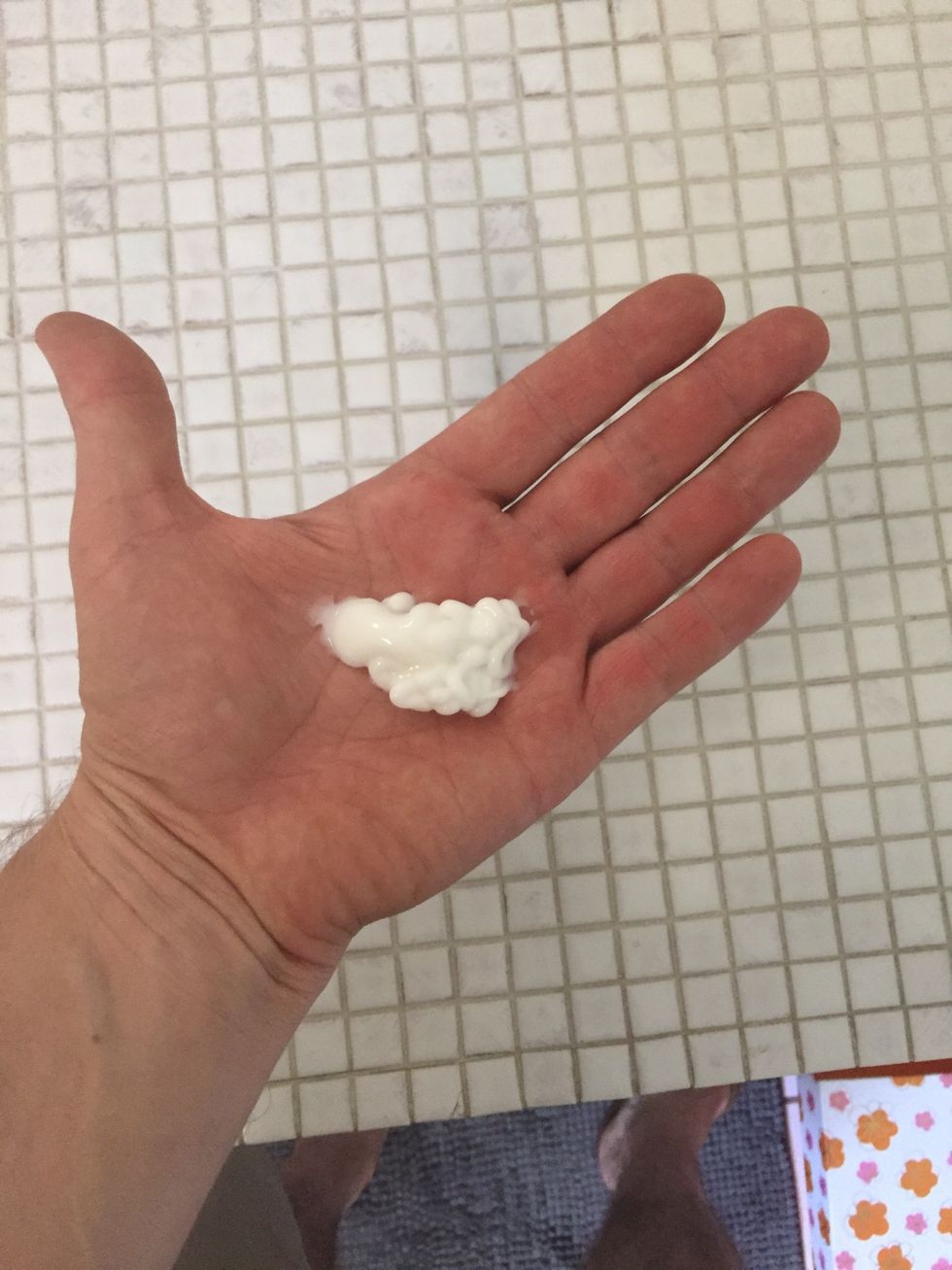 With clean, bare hands, squeeze as much lotion out onto your palm.