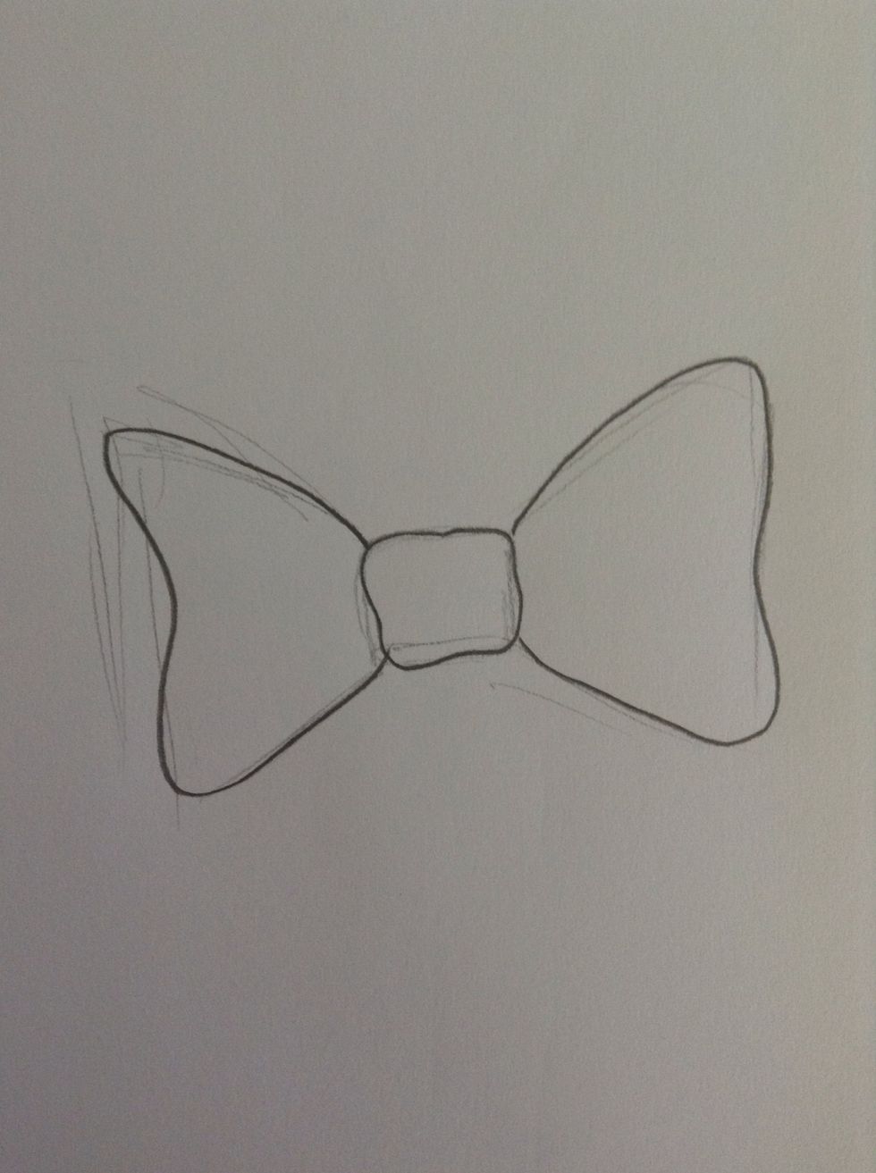 With dark lines, go over the basic shape and round the corners and give it a flowy, soft, bow-look.