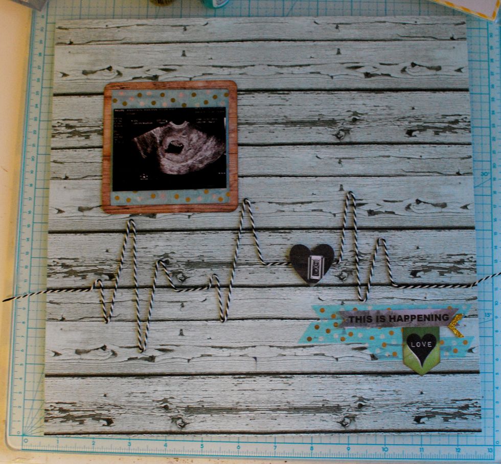 With double sided tape, secure the image to the upper left area, as pictured.