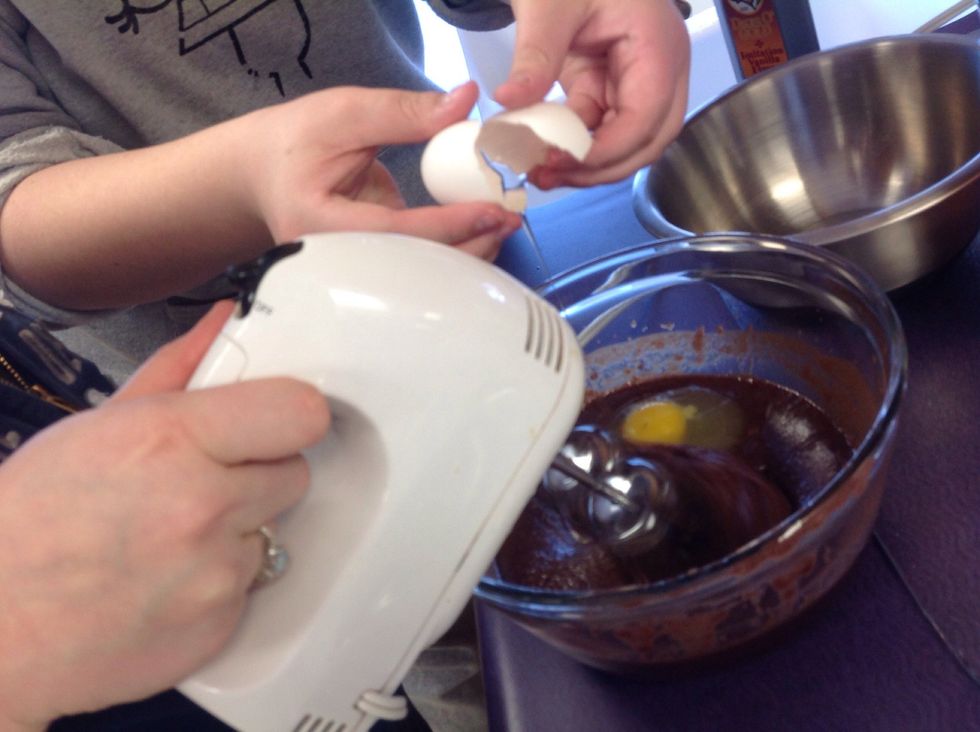 With electric mixer, beat in eggs one at a time