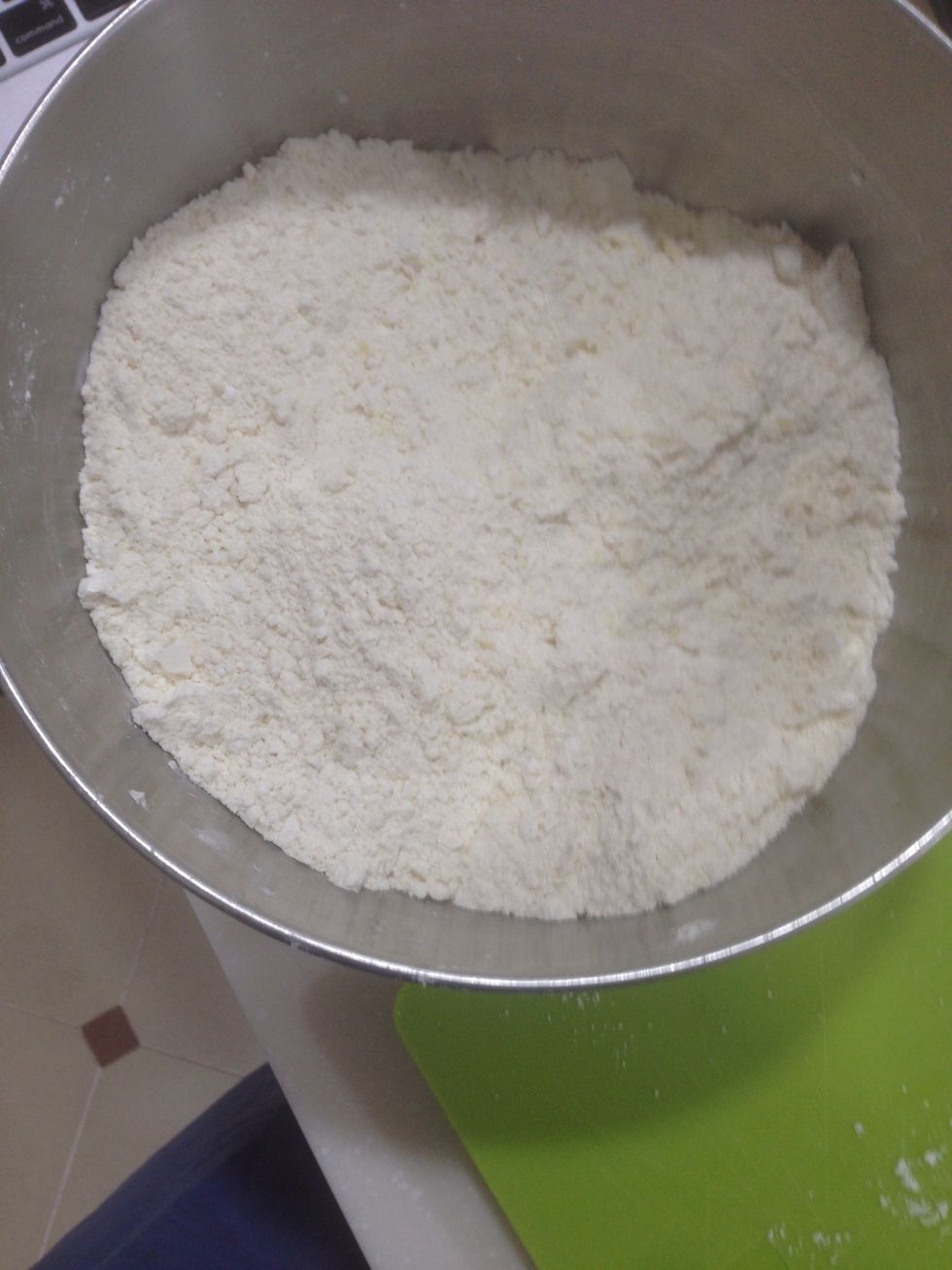 With fingers, blend butter into flour mixture.