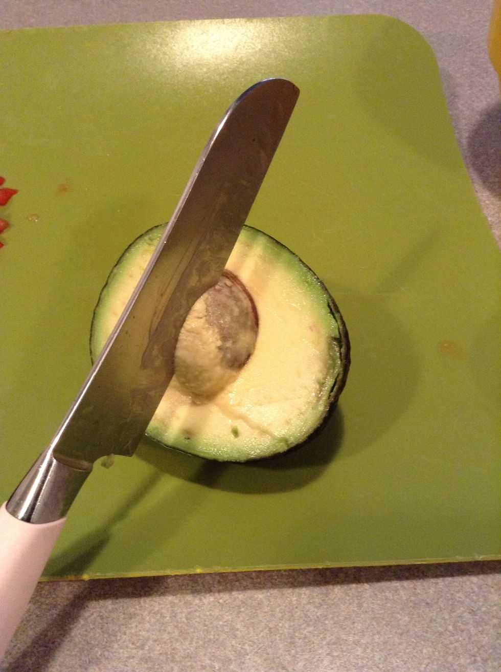 With force hit seed with knife and twist to remove seed. BE CAREFUL!