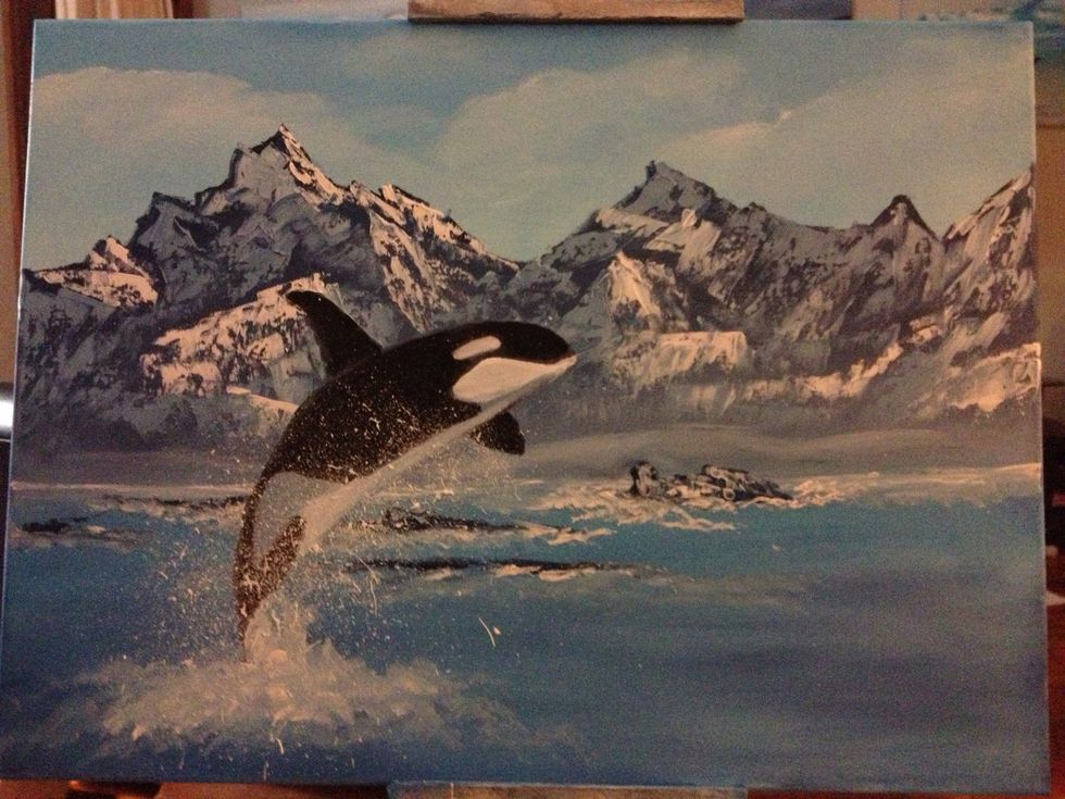 With liquid white on your fan brush, dab in some waves. Then spring the brush off of your knife to sling the spray onto the canvas.