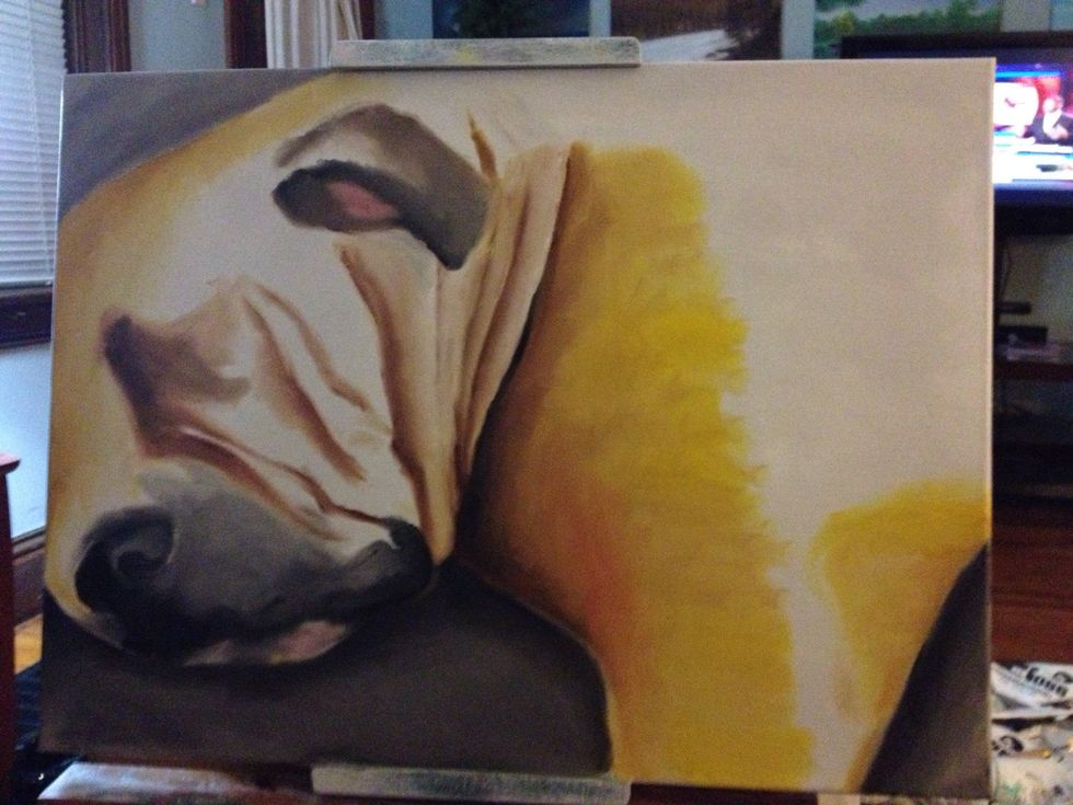 With more black, go into detail on both the ear and mouth. Clean your hand and go back in with some red and white to get the pink for the mouth and inside of the ear.