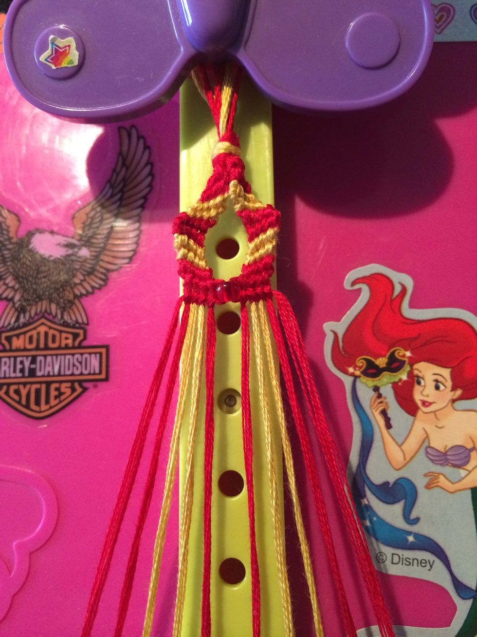 With our bead secure now we can work on the sides of the bracelet. You can start on either side of the bracelet, it doesn't matter.