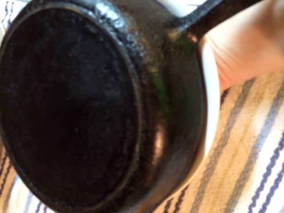 With oven mitt hand on handle flip.