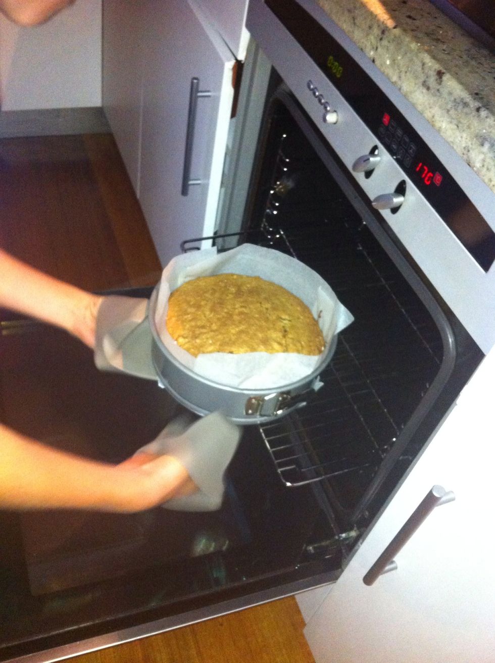 With oven mitts be cautious when removing the cake from the oven