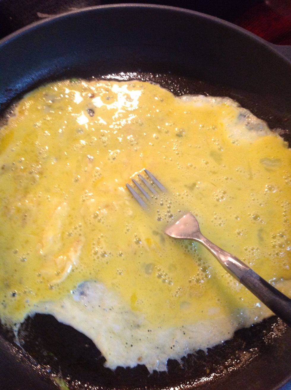 With pan on low heat, add egg and move it around with a fork for the first 30 seconds only.  Don't worry about making it perfectly...rough edges add character.