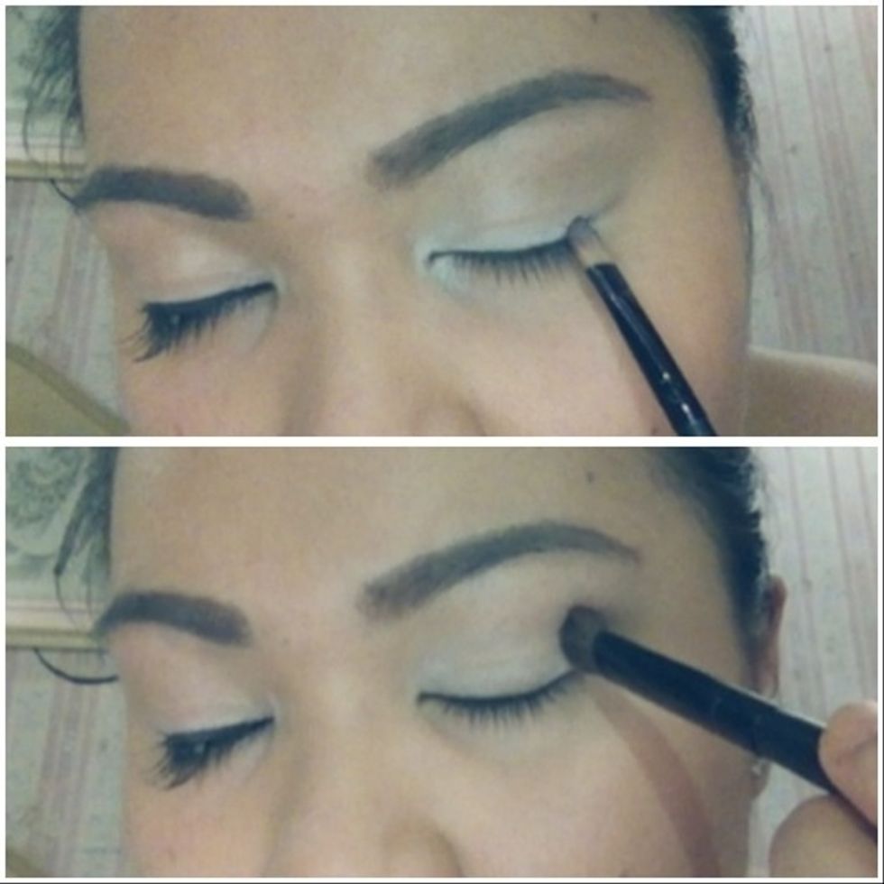 With primer ready lids, apply white eyeshadow in matte all over lids with your e/s brush and then buff it in using a fluffy brush to soften out the edges.