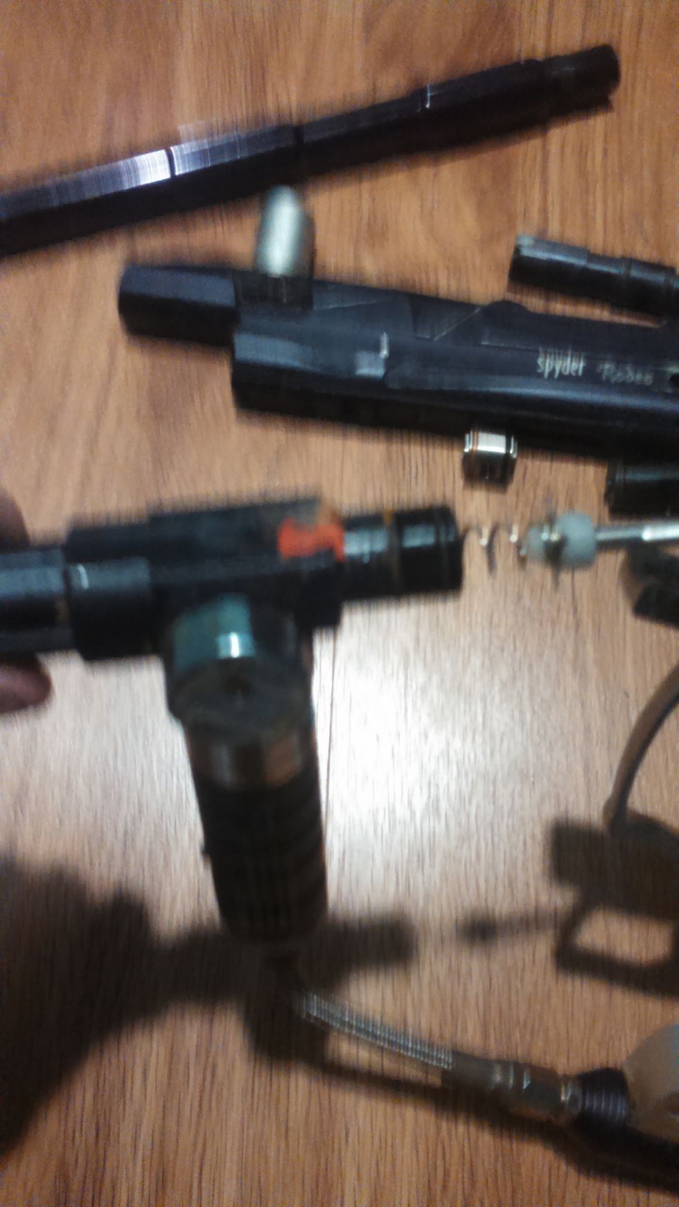 With removal of the 3rd screw the reg and volumizer assembly will detach. The poppet is the white piece shown. If this is damaged it needs replaced. Notice paint catches here, make sure its cleaned.