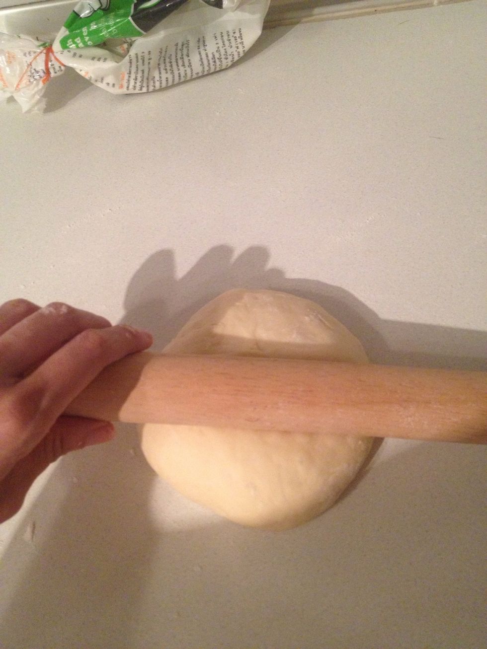 With rolling pin always roll do not push or u'll damage the dough.
