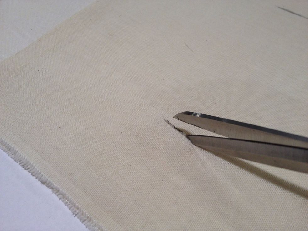 With sharp scissors, cut 1-1/4" buttonhole openings. Depending on the diameter of your rod, you may want to cut the holes a little smaller or larger.