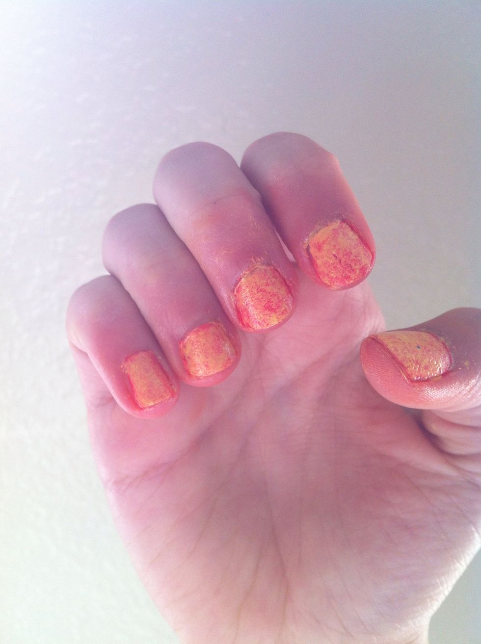 With some nail polish remover, remove the excess nail polish on your finger.