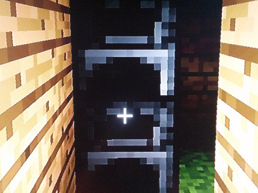 With the 16 stone blocks make 2 furnaces and place them in the far right corner on top of each other facing you. Like shown in the photo.