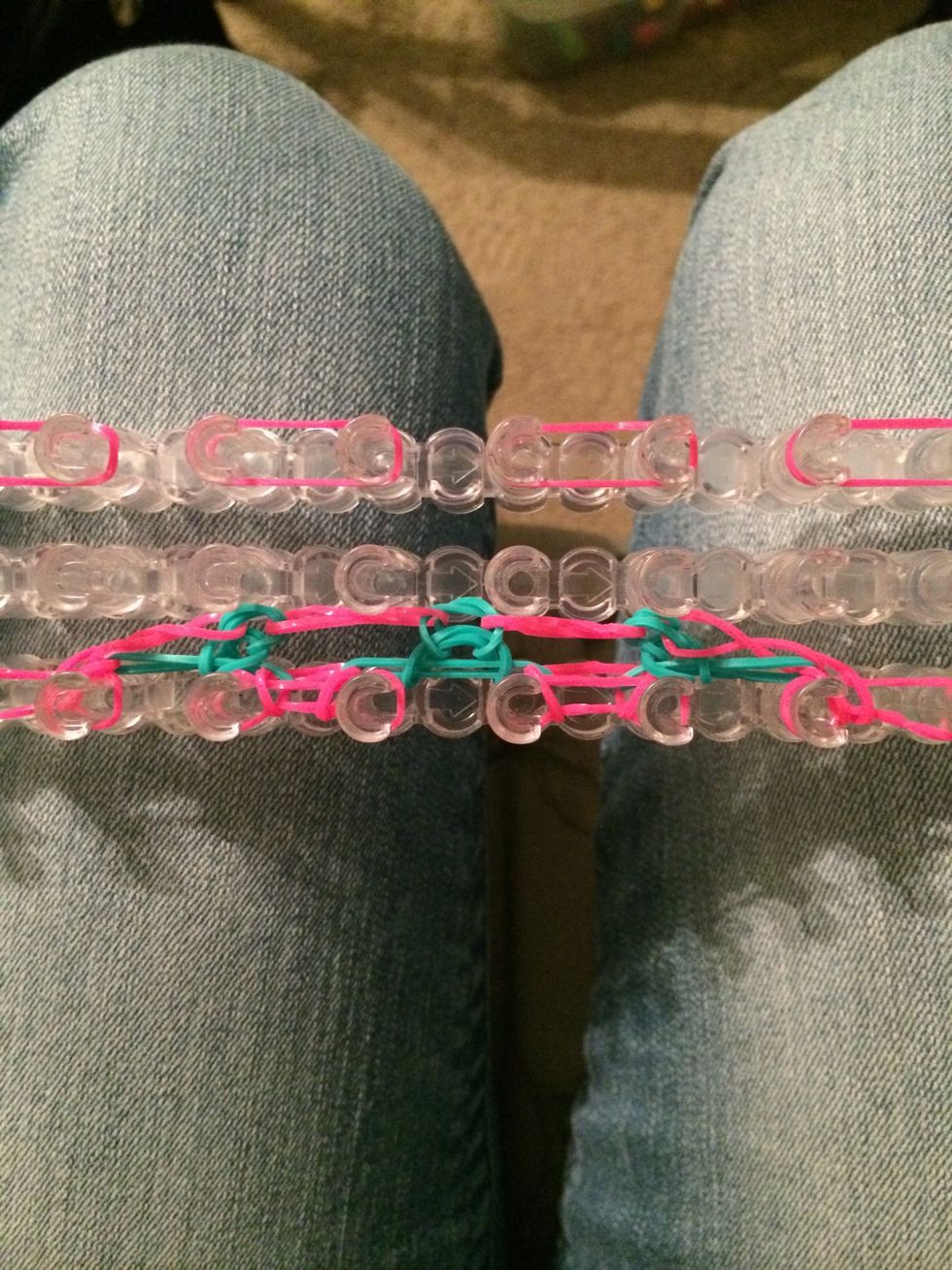With the 2nd row looped over it's time to place the last row of pink bands.