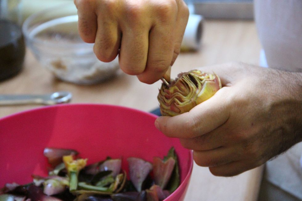 With the back of a spoon start cleaning the inside